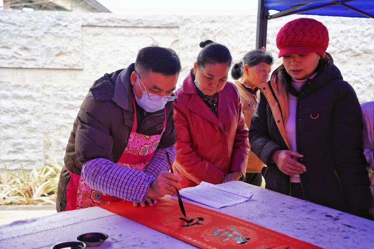 书法家写春联送祝福_安阳东站新春活动_安阳商都农商银行招聘